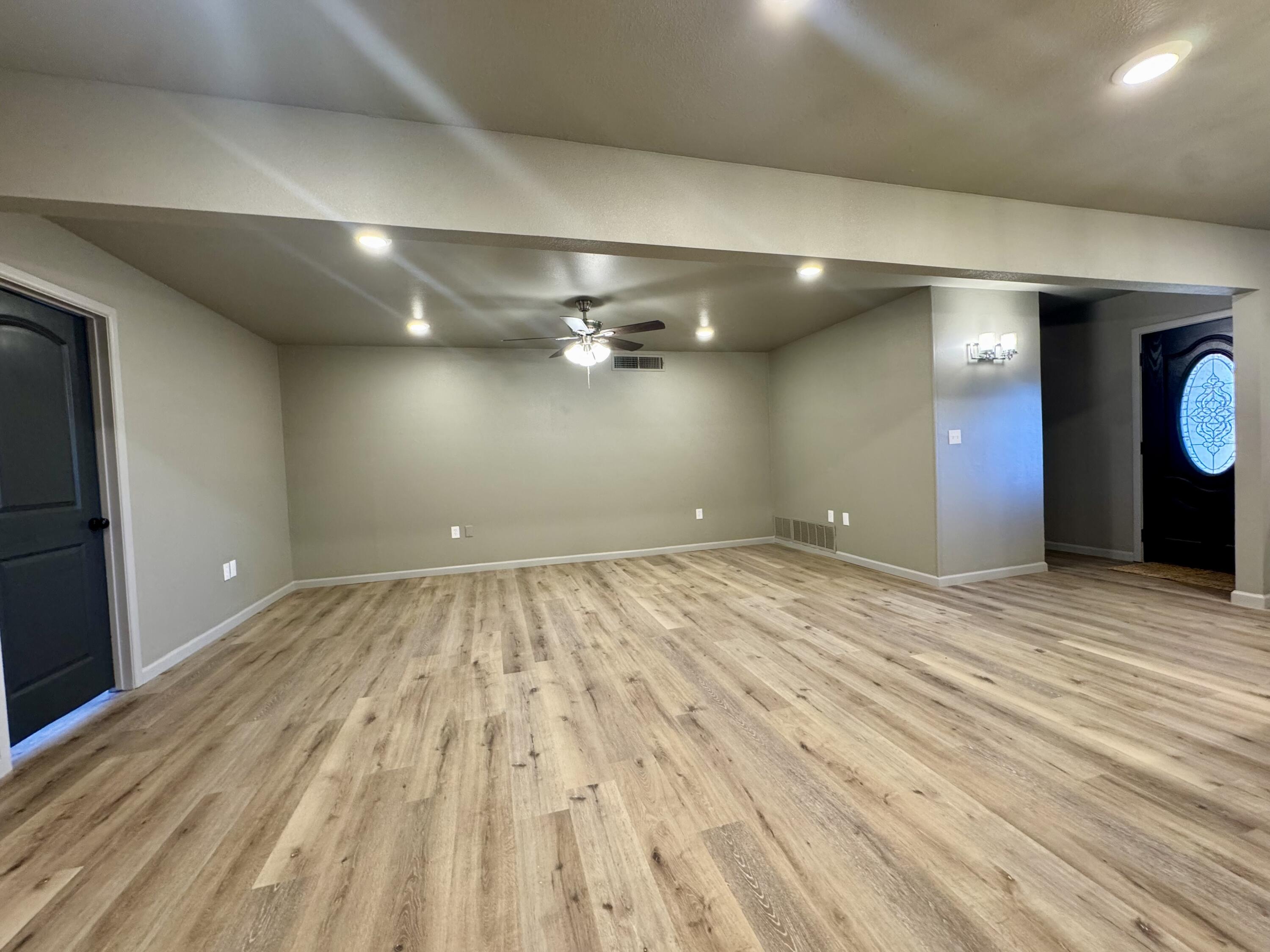 106 North 22nd Place Lamesa, TX 79331 - Photo 28 of 82 an empty room with wooden floor