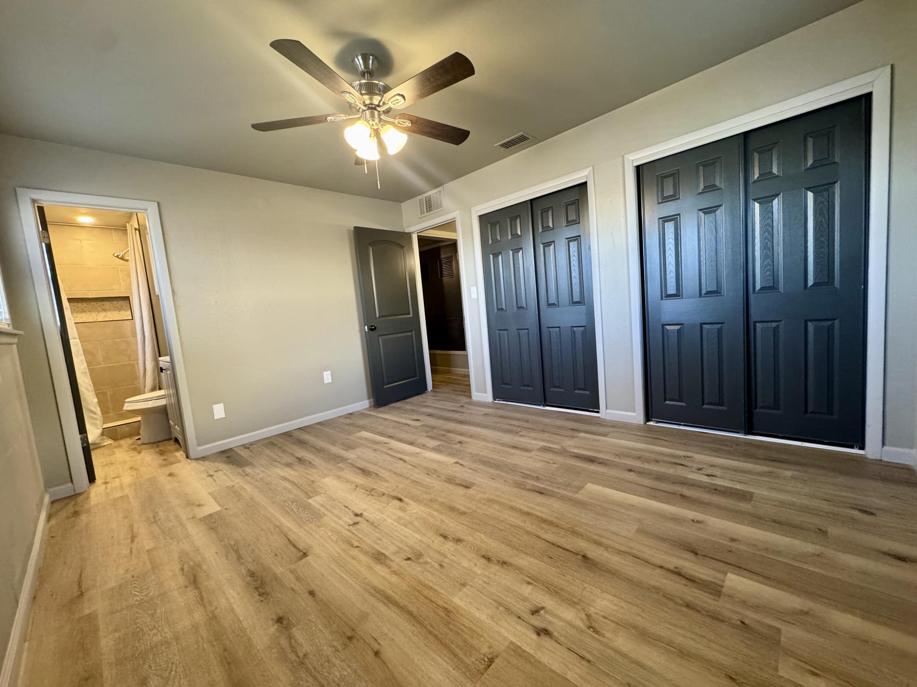 106 North 22nd Place Lamesa, TX 79331 - Photo 37 of 82 a view of an empty room with wooden floor
