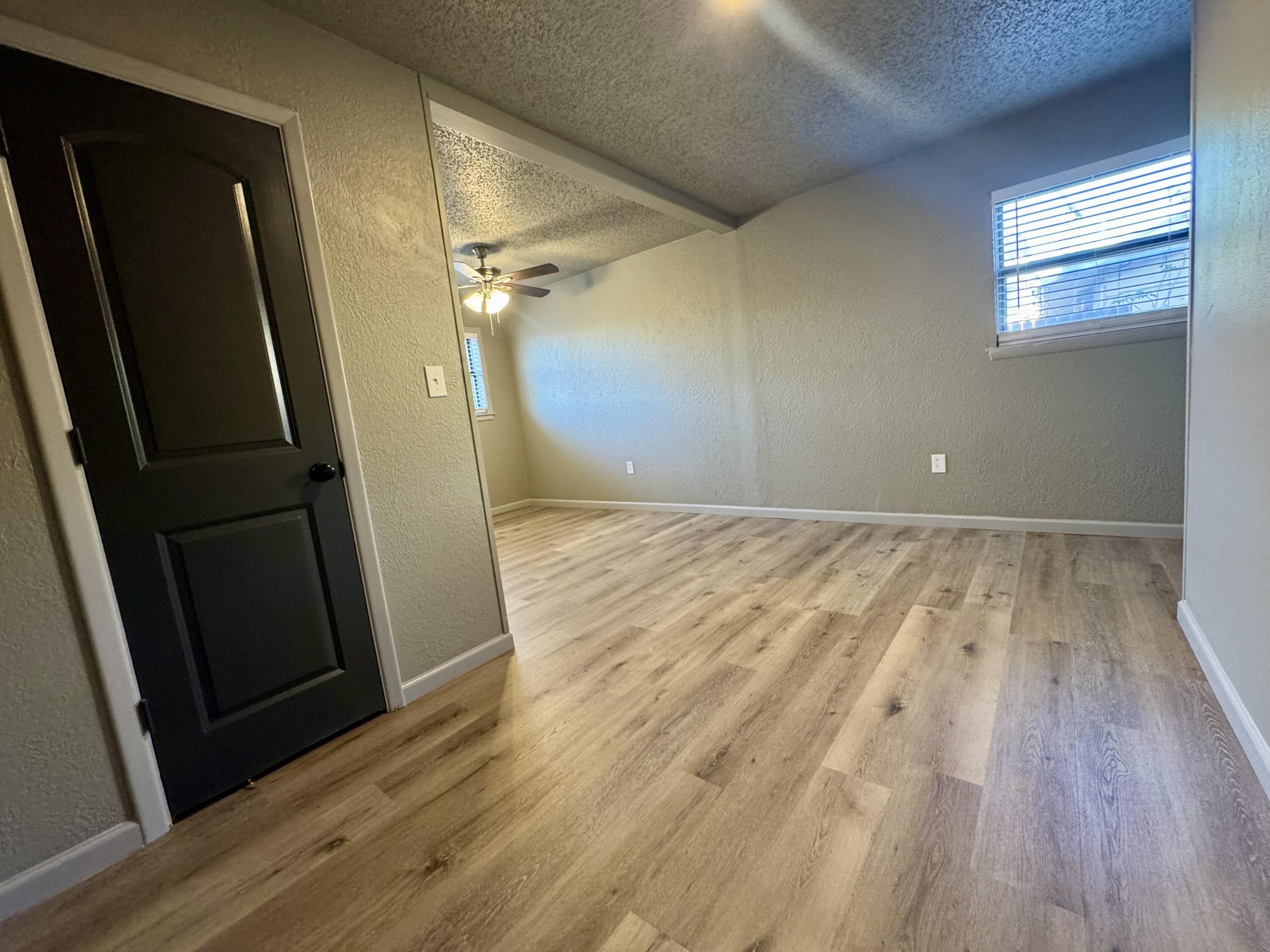 106 North 22nd Place Lamesa, TX 79331 - Photo 50 of 82 wooden floor in an empty room