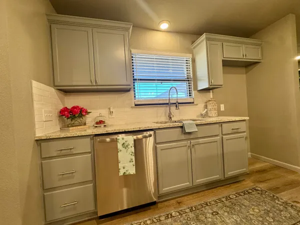 a bathroom with a sink mirror and toilet