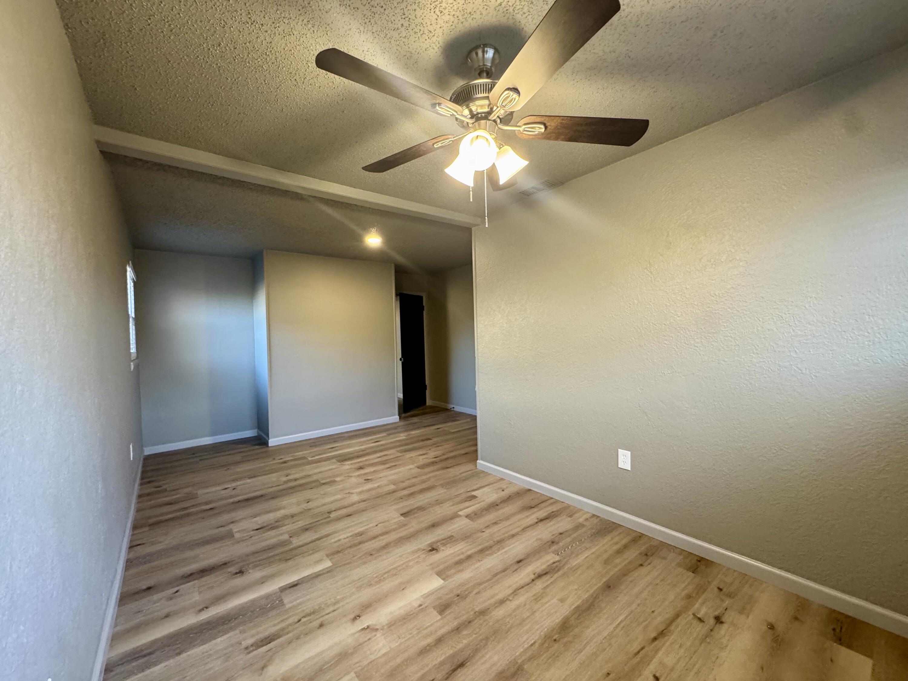 106 North 22nd Place Lamesa, TX 79331 - Photo 53 of 82 wooden floor in an empty room