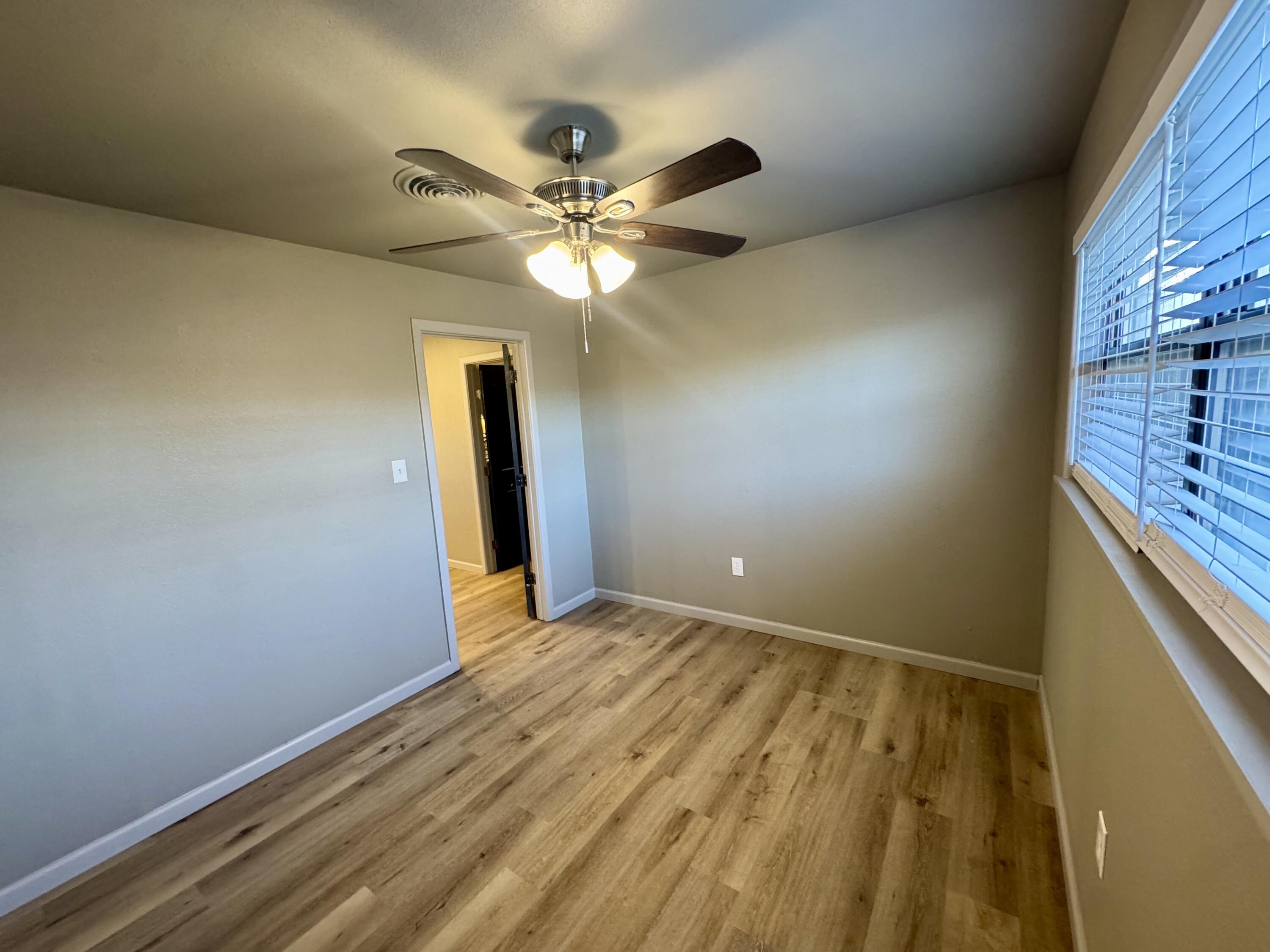 106 North 22nd Place Lamesa, TX 79331 - Photo 60 of 82 a view of an empty room and chandelier fan