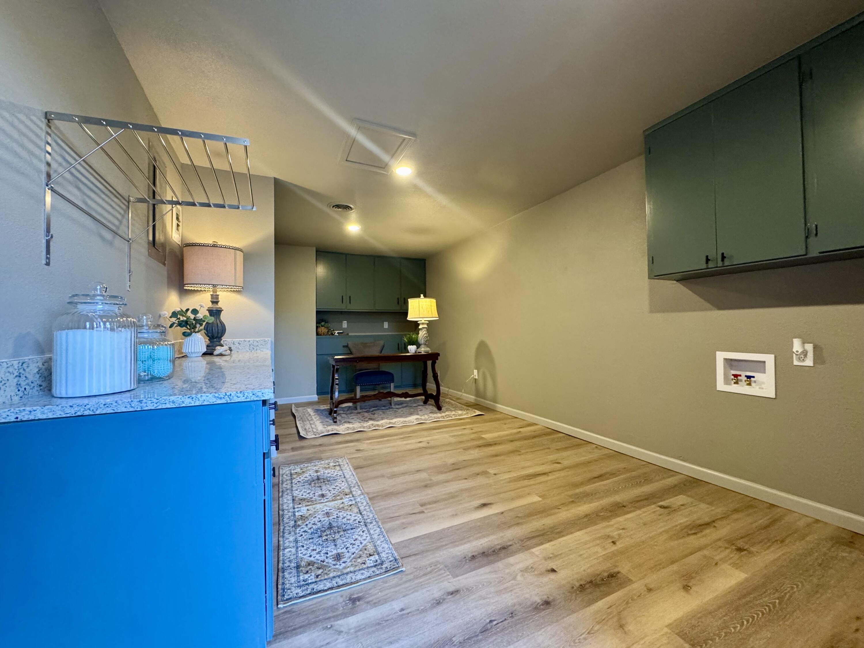 106 North 22nd Place Lamesa, TX 79331 - Photo 61 of 82 a view of kitchen and dining room with wooden floor