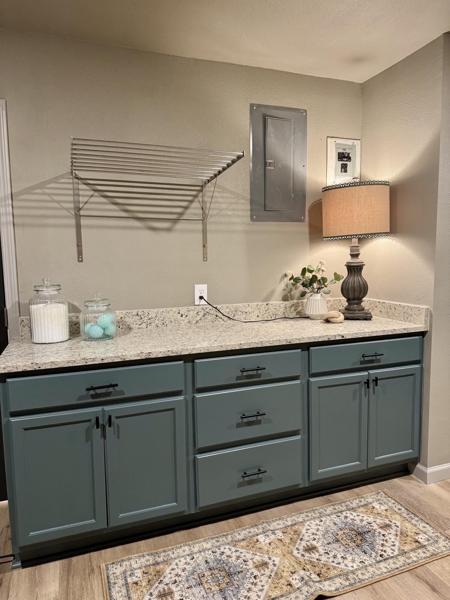 106 North 22nd Place Lamesa, TX 79331 - Photo 67 of 82 a bathroom with a granite countertop sink and mirror