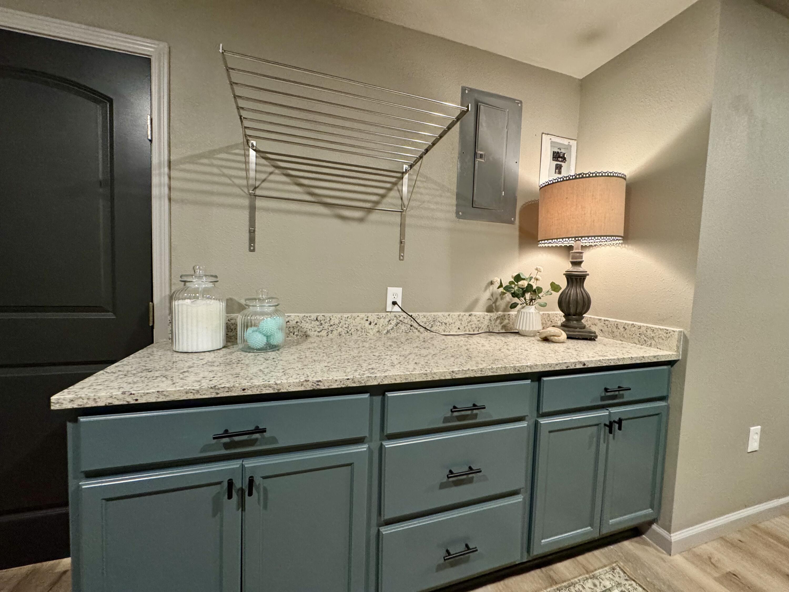 106 North 22nd Place Lamesa, TX 79331 - Photo 68 of 82 a bathroom with a granite countertop sink and a mirror
