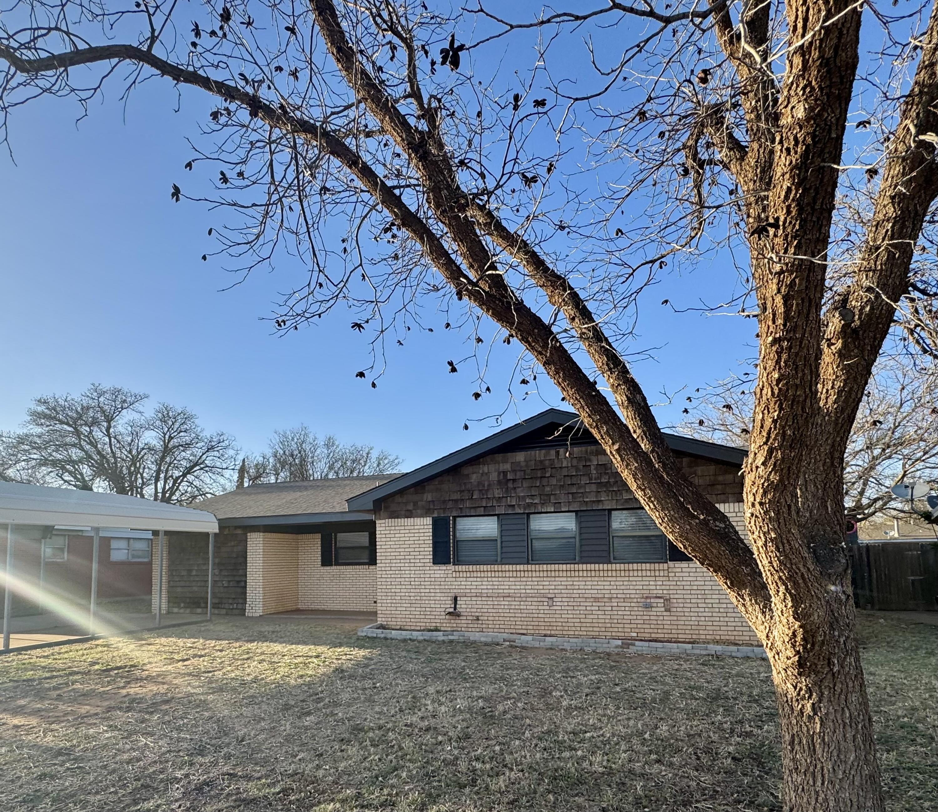 106 North 22nd Place Lamesa, TX 79331 - Photo 76 of 82 a front view of a house with a yard