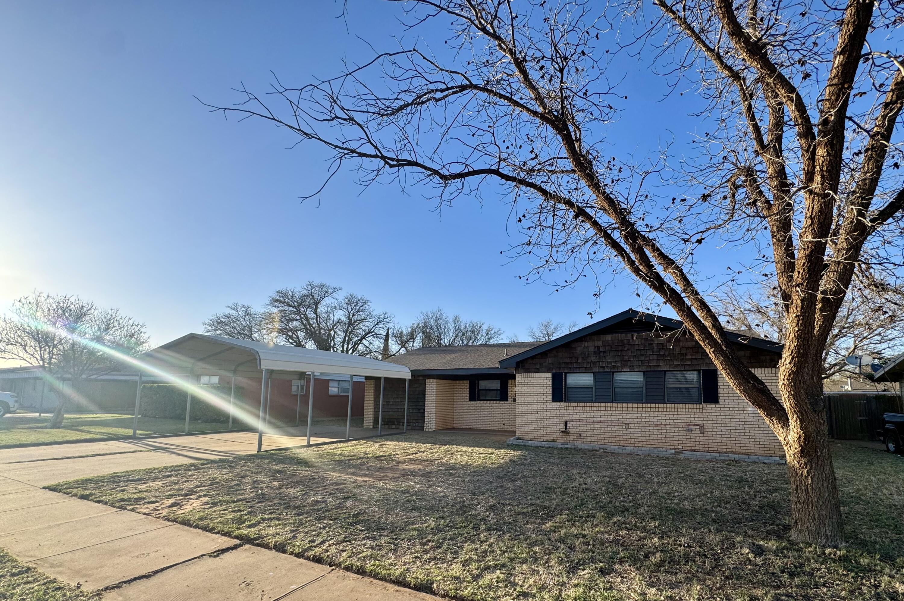 106 North 22nd Place Lamesa, TX 79331 - Photo 82 of 82 a front view of a house with a yard