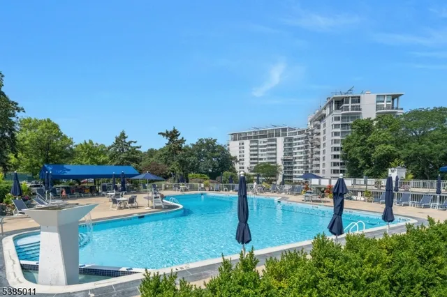 a view of a water fountain and an outdoor seating
