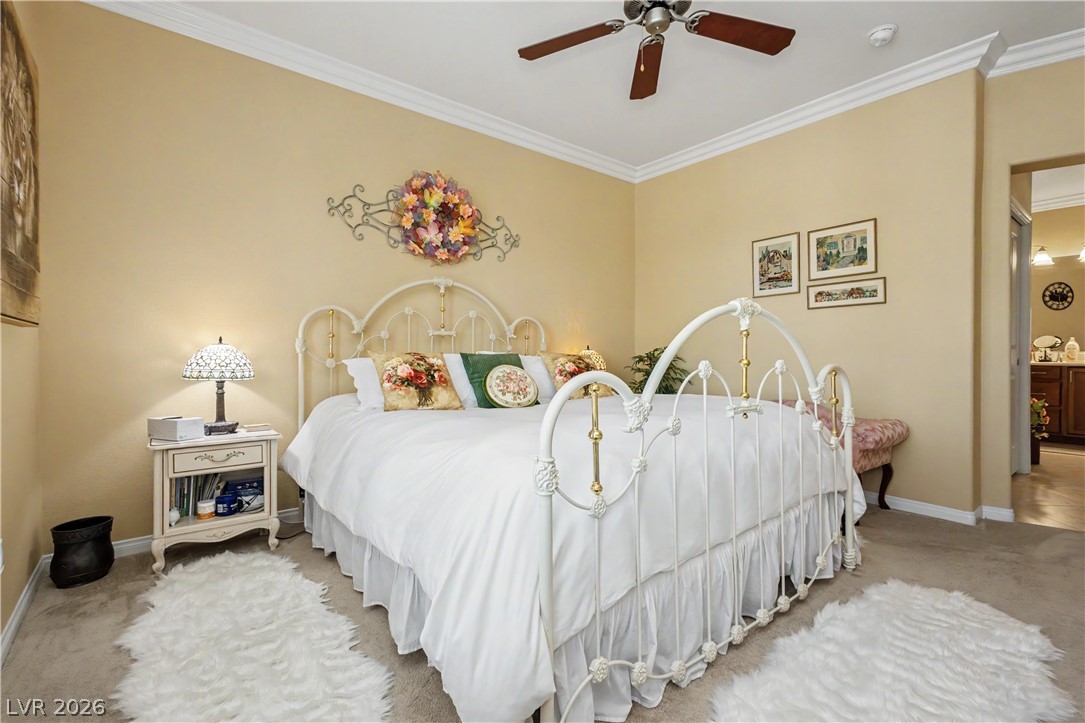 2555 Hampton Road, Unit 3308 Henderson, NV 89052 - Photo 36 of 65 Sweet dreams await in this comfortable bedroom with a warm ambiance and functional ceiling fan.