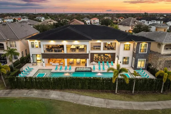 an aerial view of residential houses with outdoor space