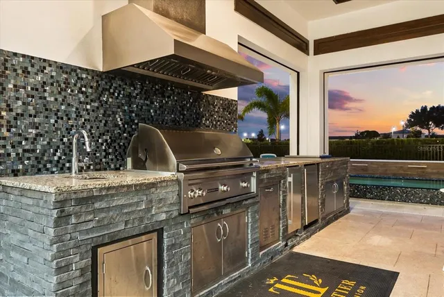 a living room with fireplace furniture and a large window