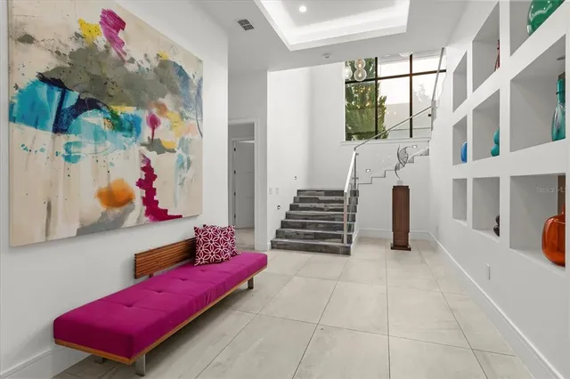 a bedroom with furniture and a chair