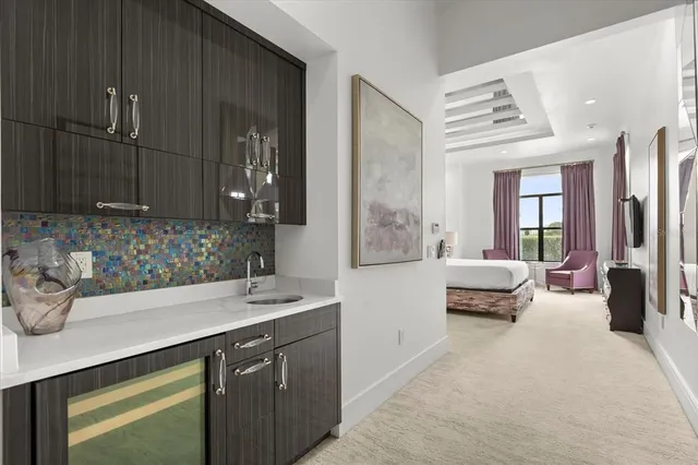 a kitchen with a stove and a refrigerator