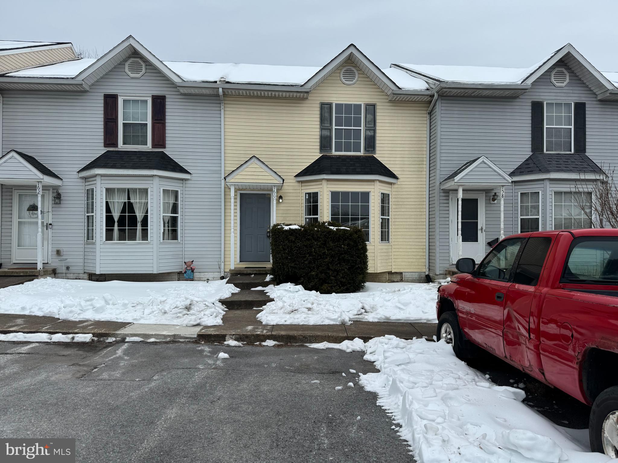 a front view of a house with yard