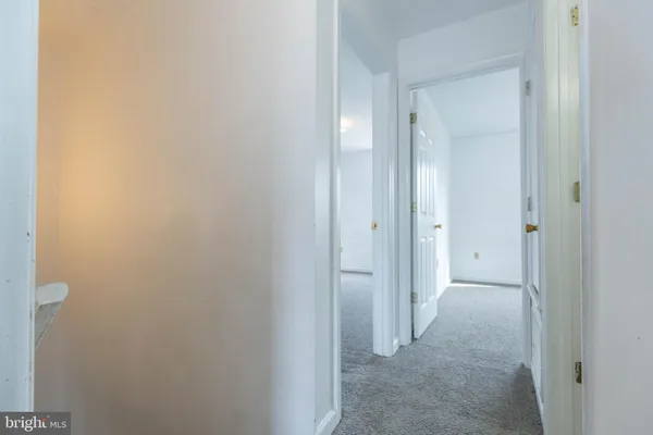 a view of a bathroom from the hallway