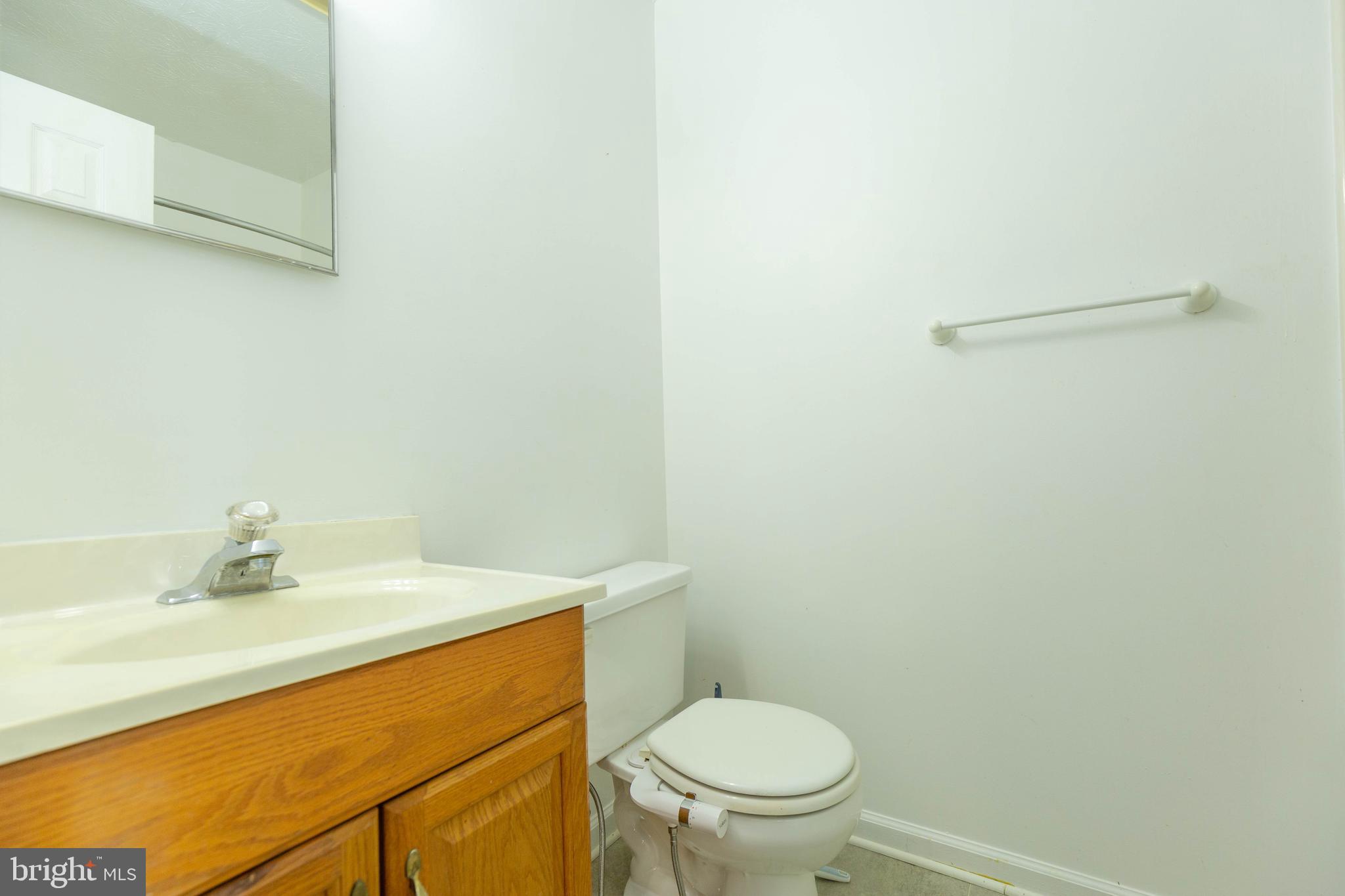 160 Stadium Circle Inwood, WV 25428 - Photo 16 of 29 a bathroom with a sink a toilet and a mirror