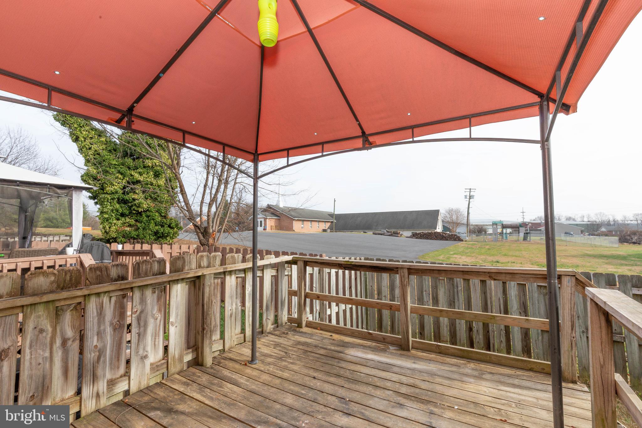 160 Stadium Circle Inwood, WV 25428 - Photo 27 of 29 a view of a balcony with wooden floor next to a yard