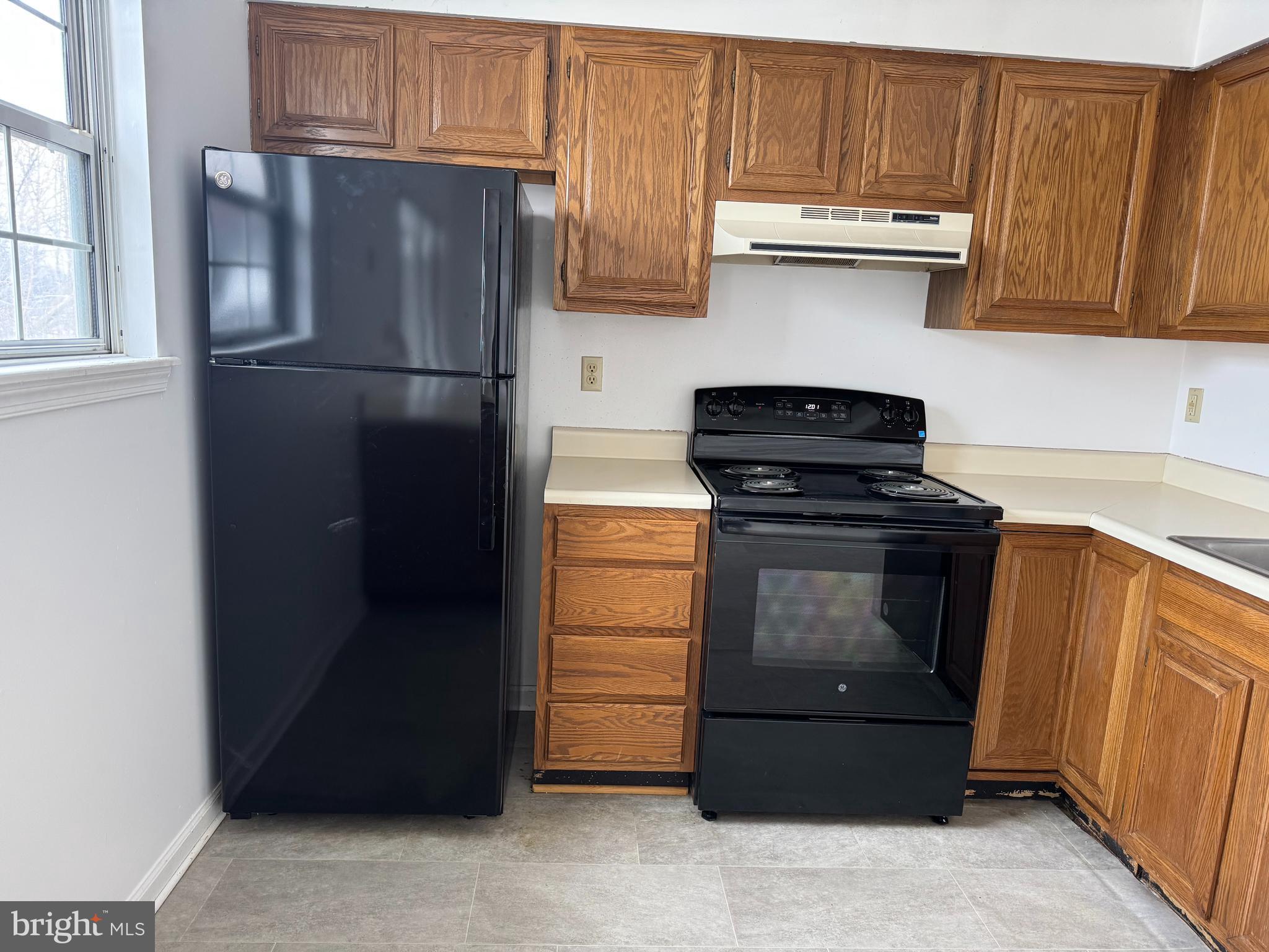 160 Stadium Circle Inwood, WV 25428 - Photo 8 of 29 a kitchen with stainless steel appliances granite countertop a refrigerator and a stove