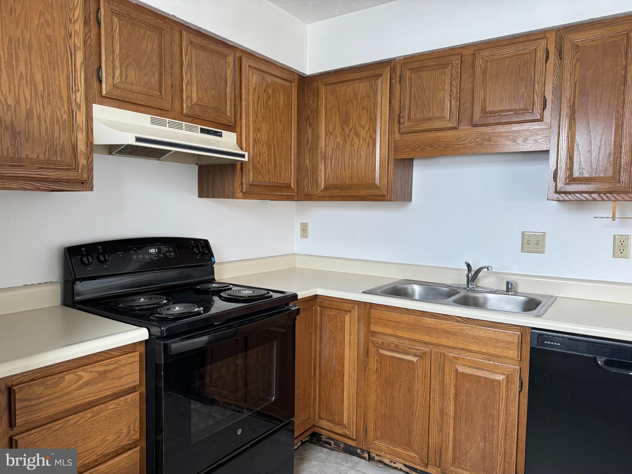 160 Stadium Circle Inwood, WV 25428 - Photo 9 of 29 a kitchen with stainless steel appliances granite countertop a sink stove and cabinets