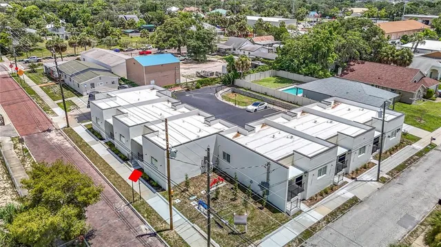 an aerial view of residential house with outdoor space and swimming pool