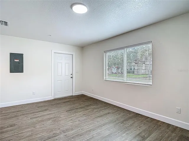 a bathroom with a shower curtain and toilet