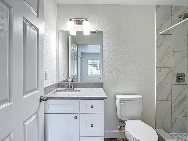 a front view of a house with a yard and a garage