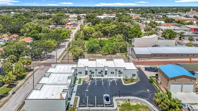 a view of an empty room with closet and a window