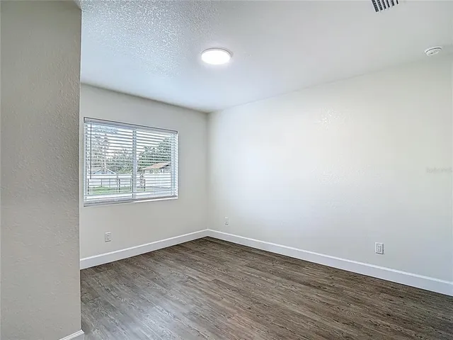 an aerial view of residential houses with outdoor space and swimming pool