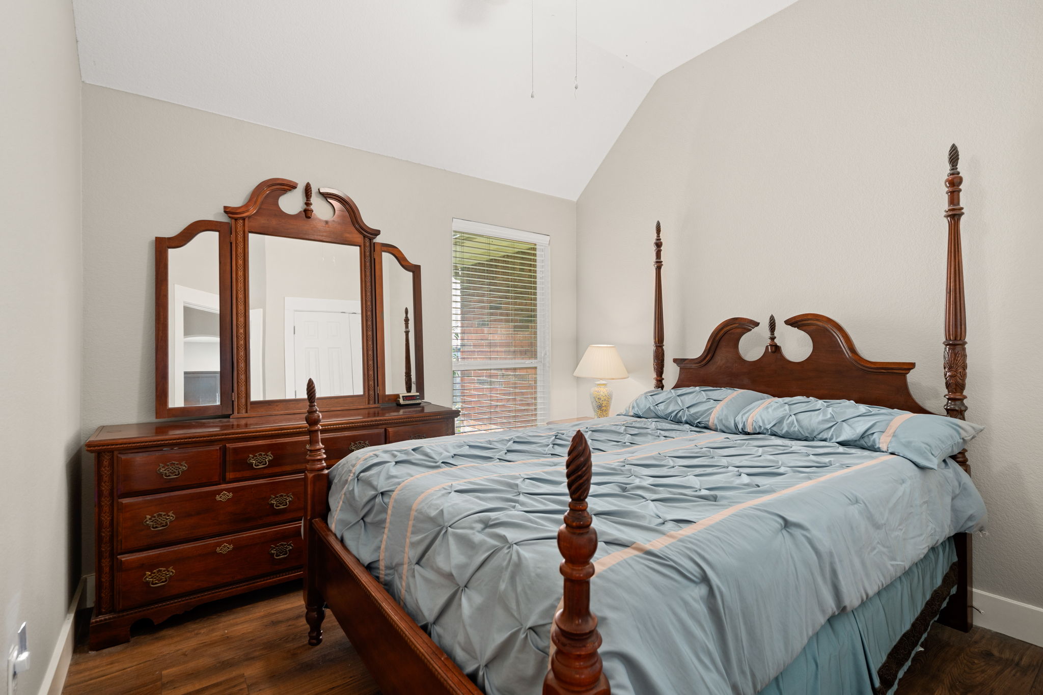 1718 Nelson Ranch Loop Cedar Park, TX 78613 - Photo 19 of 33 a bedroom with a bed and a large mirror next to a large window