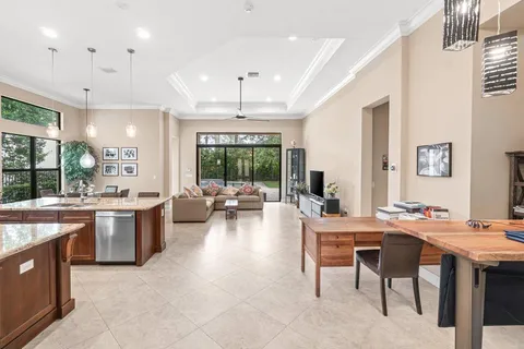 a large kitchen with a table and chairs in it