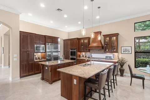 a kitchen that has a table and chairs in it