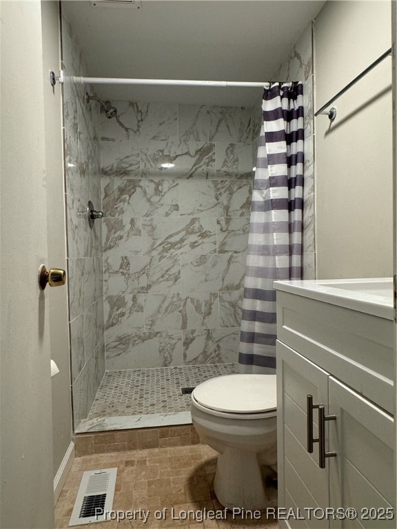 293 Army Road Raeford, NC 28376 - Photo 21 of 31 a bathroom with a toilet and a shower