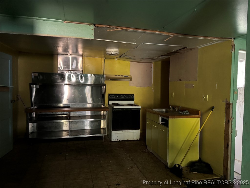 293 Army Road Raeford, NC 28376 - Photo 29 of 31 a stove top oven sitting inside of a kitchen