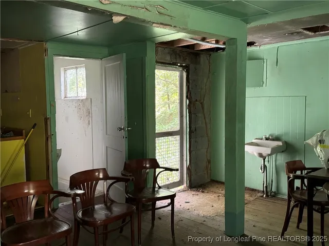 a view of a livingroom with furniture and windows