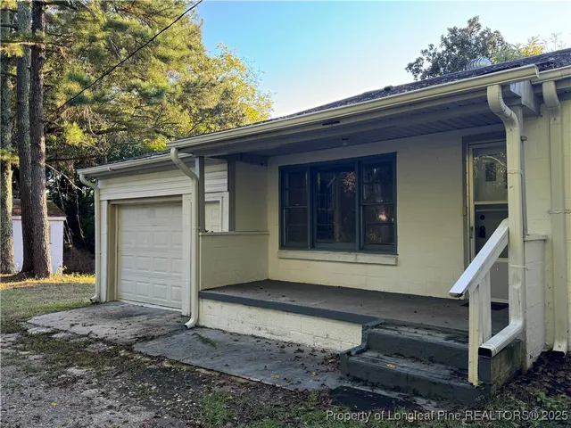 a front view of a house with a garage
