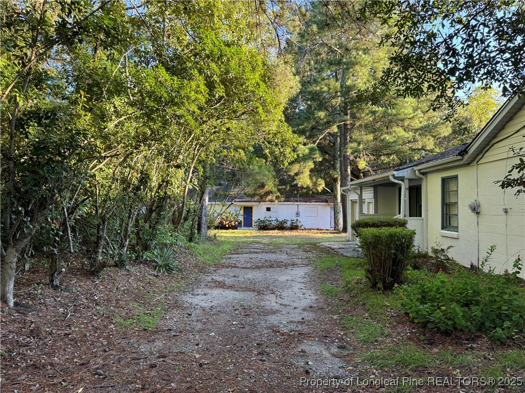 293 Army Road Raeford, NC 28376 - Photo 5 of 31 a front view of a house with garden