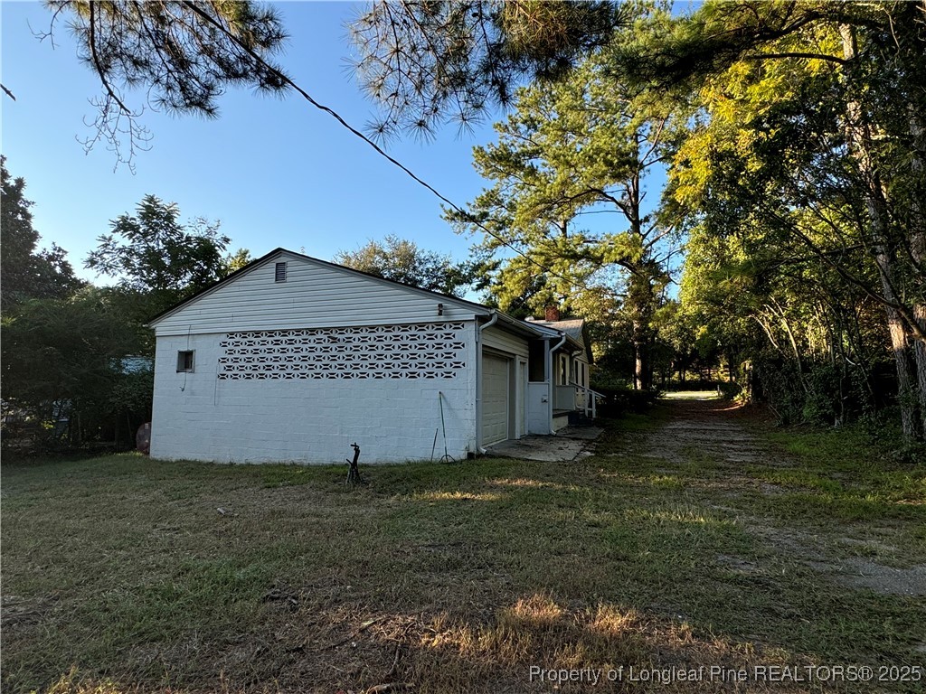 293 Army Road Raeford, NC 28376 - Photo 6 of 31 a view of a house with a yard