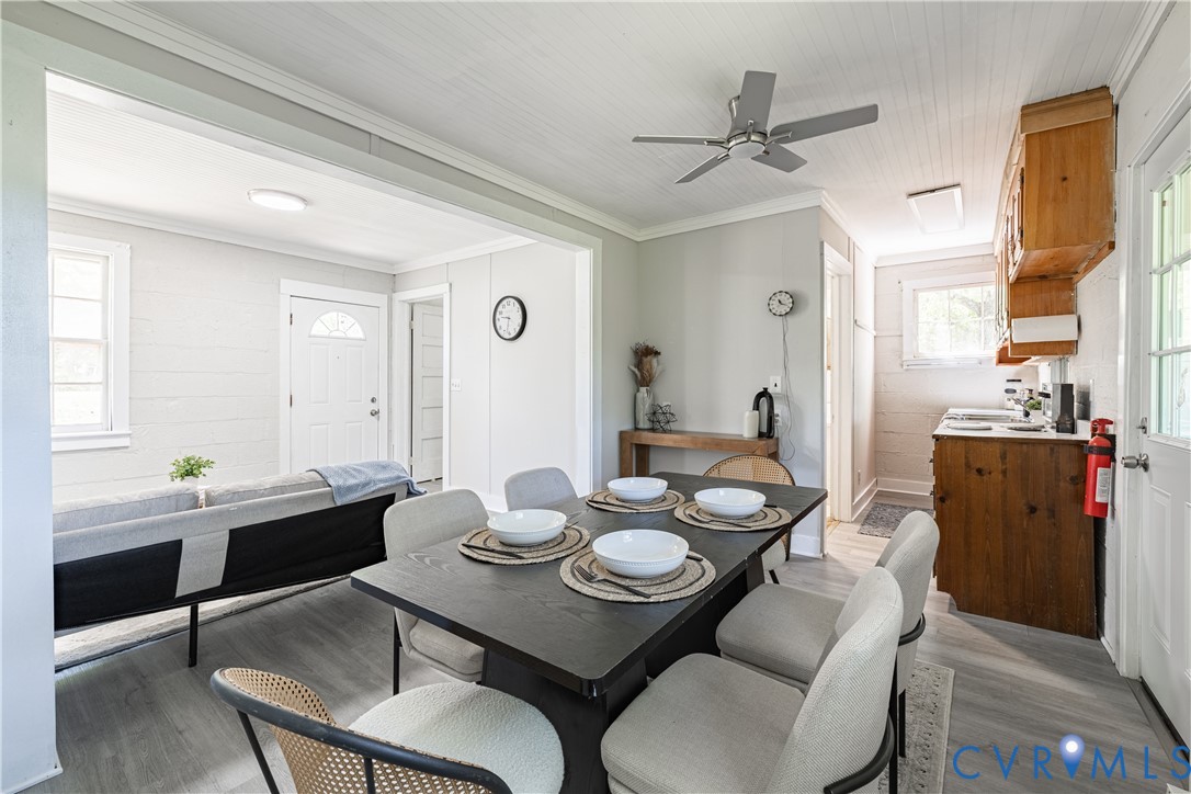 933 Pleasant Point Road Surry, VA 23883 - Photo 8 of 45 a view of a dining room with furniture and a chandelier
