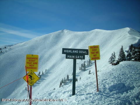 197 Prospector Road, Unit 2312 FW 21 22 49 Aspen, CO 81611 - Photo 15 of 19 a street sign sitting on top of a road