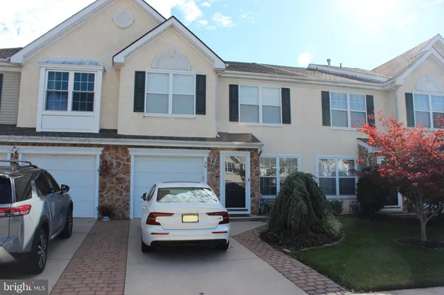 a car parked in front of a house
