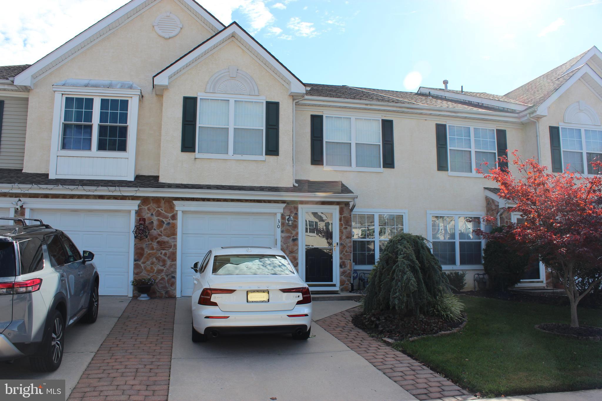 a car parked in front of a house