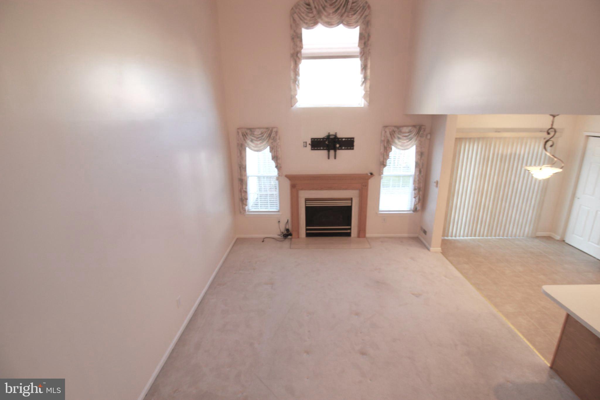 30 Leighton Drive Mount Laurel, NJ 08054 - Photo 11 of 22 a view of an empty room with a window and fireplace