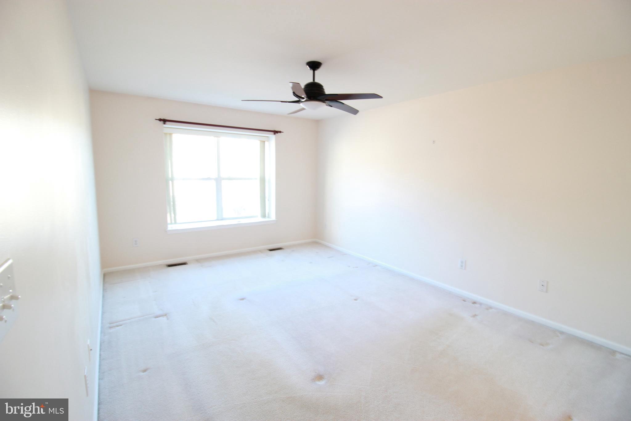 30 Leighton Drive Mount Laurel, NJ 08054 - Photo 12 of 22 an empty room with a window and a ceiling fan