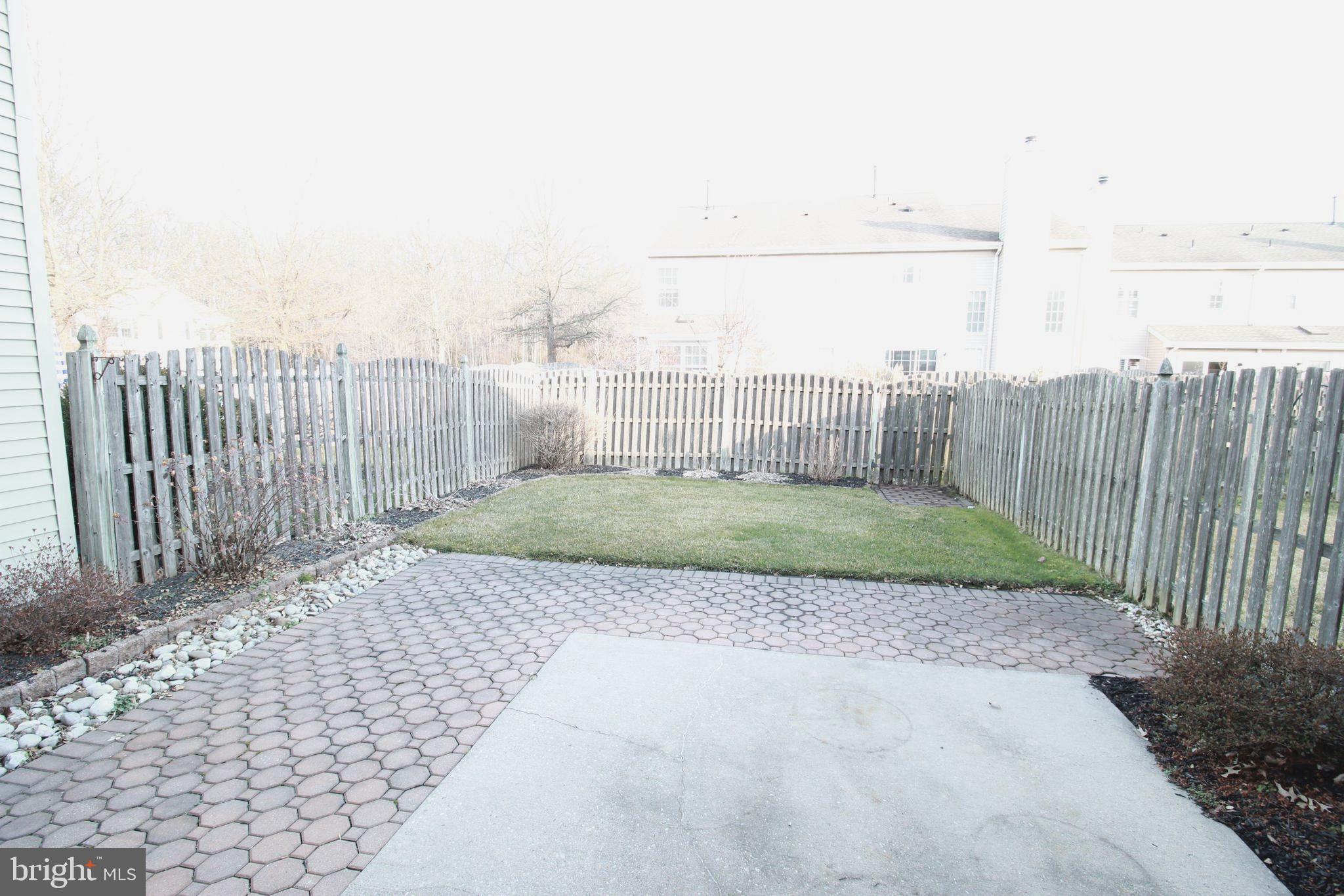 30 Leighton Drive Mount Laurel, NJ 08054 - Photo 20 of 22 a view of a backyard with wooden fence