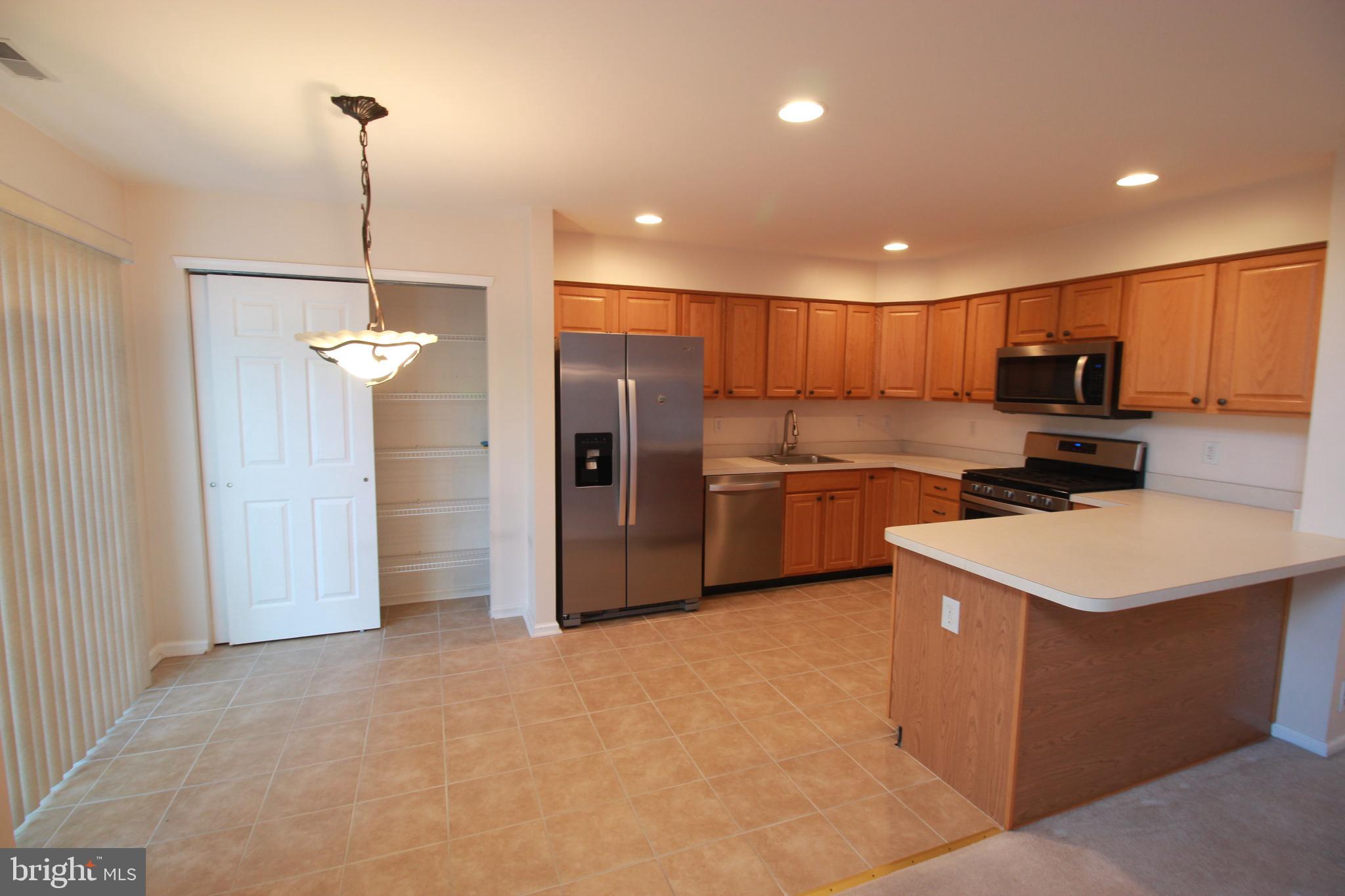30 Leighton Drive Mount Laurel, NJ 08054 - Photo 6 of 22 a kitchen with stainless steel appliances a refrigerator sink and microwave