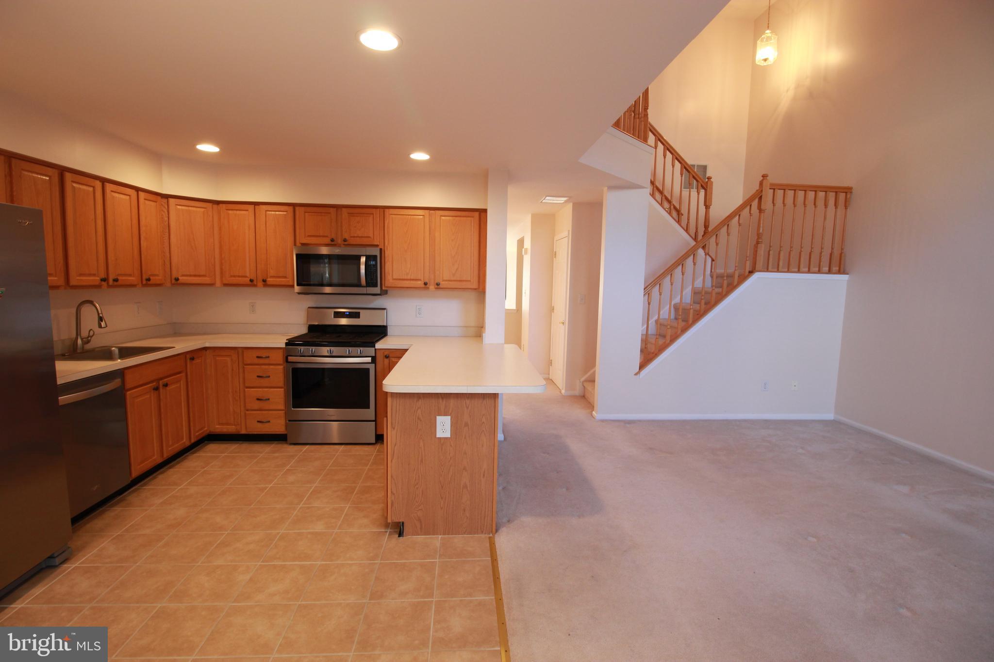 30 Leighton Drive Mount Laurel, NJ 08054 - Photo 7 of 22 a kitchen with kitchen island granite countertop a sink a counter top space appliances and cabinets