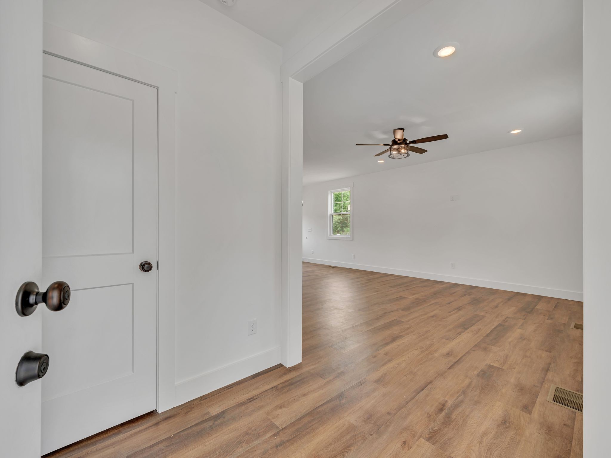 5800 Sanders Road Lyles, TN 37098 - Photo 4 of 28 a view of an empty room with wooden floor