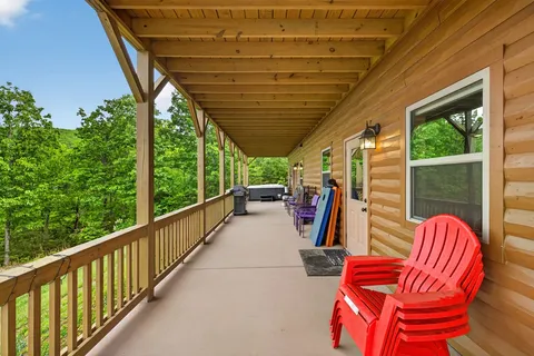 a view of two chairs in the balcony
