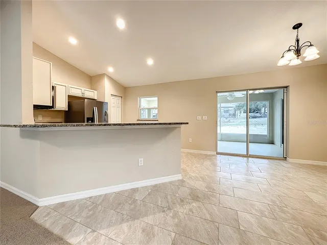 a view of a kitchen with a sink and cabinets