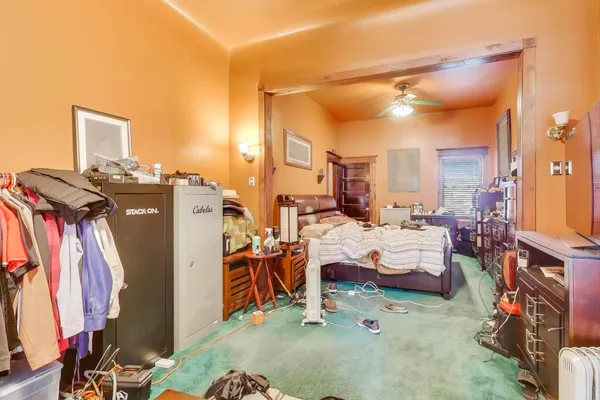 a bed room with a bed and a couch